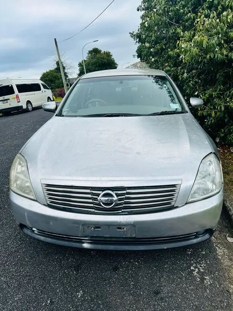 Silver Nissan Teana sedan bought for cash