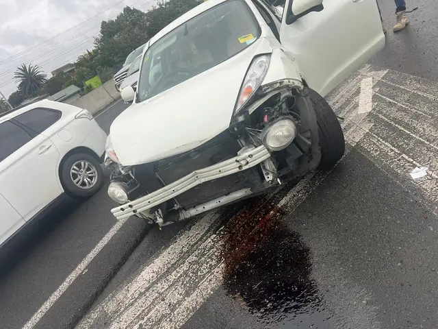 White hatchback written off after a front-end crash