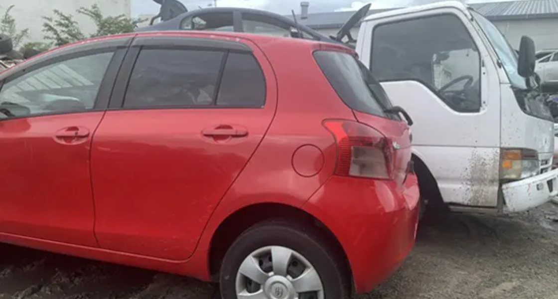 Scrap car being loaded onto a removal truck in Wellington