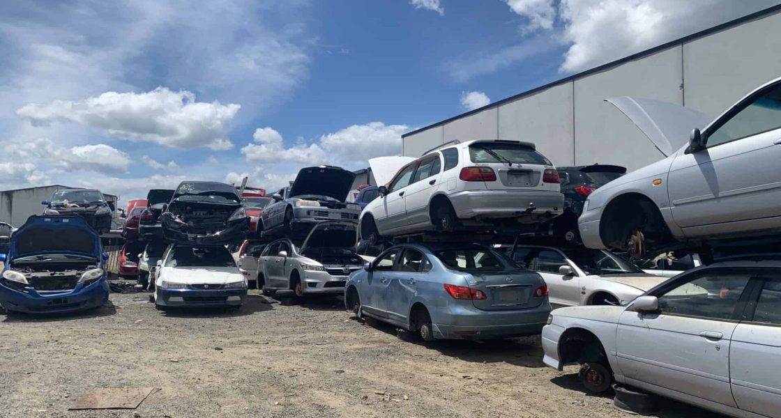 Scrap car yard in Wellington with unwanted vehicles.